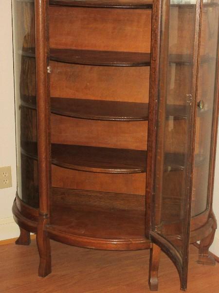 Traditional Tiger Oak Bow Front China Curio Cabinet Features Curved Glass, Demi-Columns