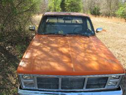 1986 Orange and Black GMC Truck