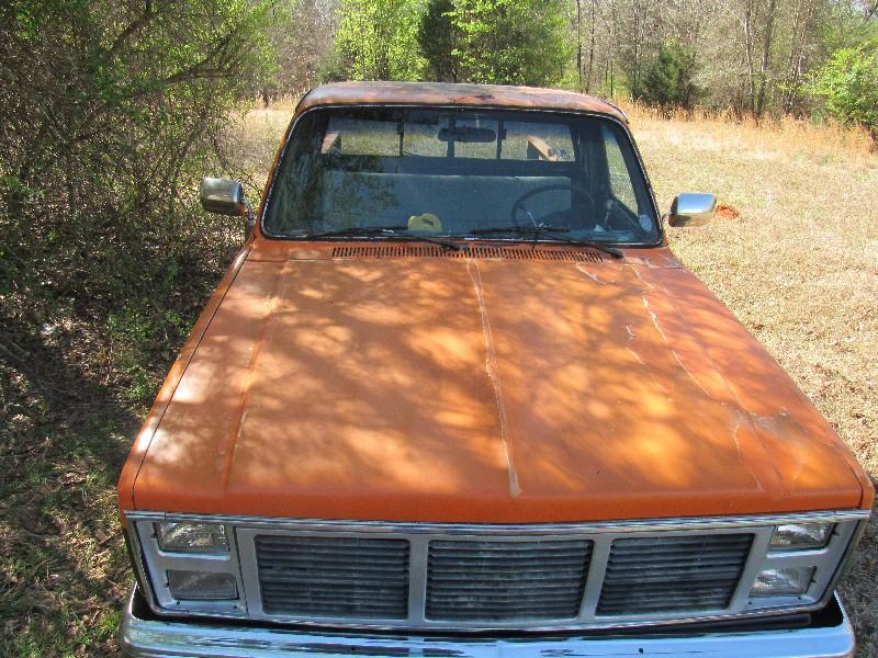 1986 Orange and Black GMC Truck