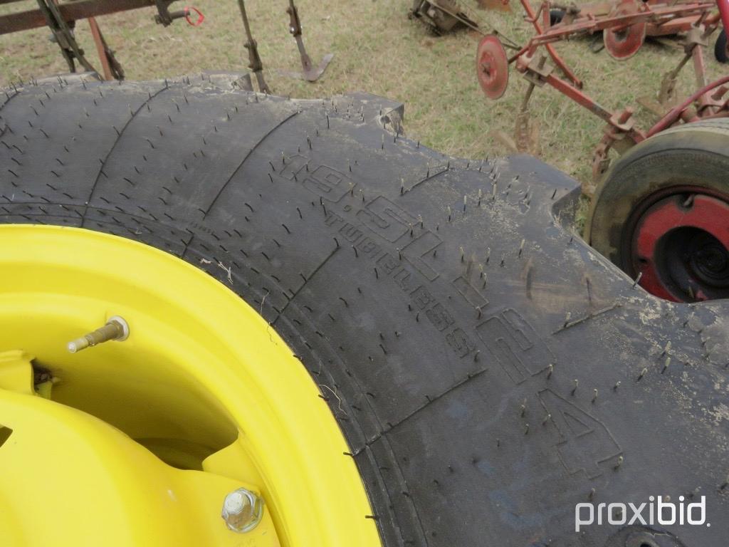 (2) Goodyear 19.5-24 tires on JD wheels