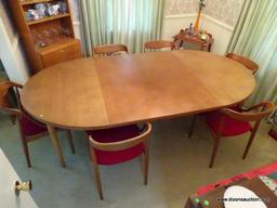 (DR) DANISH-MODERN DINING ROOM TABLE. HAS 2 LEAVES AND 6 DINING CHAIRS. LEAVES ARE 19'' WIDE EACH.