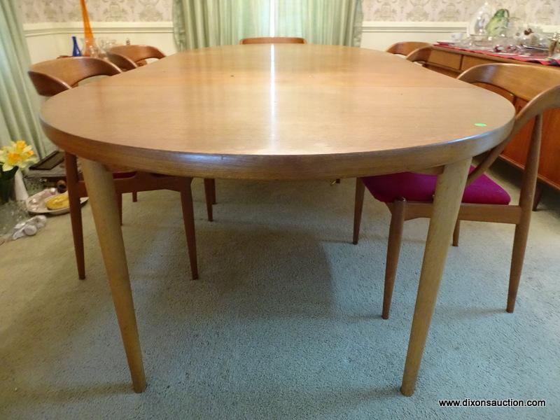 (DR) DANISH-MODERN DINING ROOM TABLE. HAS 2 LEAVES AND 6 DINING CHAIRS. LEAVES ARE 19'' WIDE EACH.