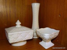 (DR) SHELF LOT OF MILK GLASS. INCLUDES A LIDDED CANDY DISH, A COMPOTE, A CANDLE HOLDER 6'' TALL, A