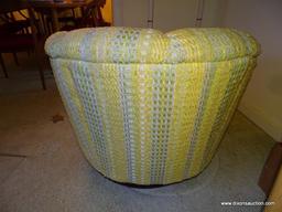 (FR) 1 OF A PAIR OF UPHOLSTERED BARREL BACK SWIVEL ARM CHAIRS. 30''X35''X27''