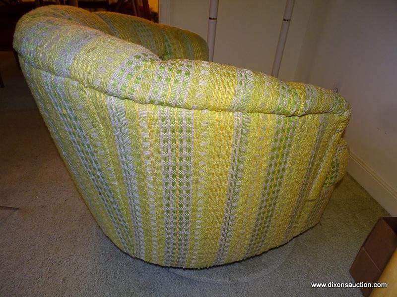 (FR) 1 OF A PAIR OF UPHOLSTERED BARREL BACK SWIVEL ARM CHAIRS. 30''X35''X27''