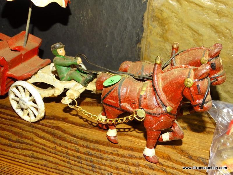 CAST IRON COCA COLA HORSE DRAWN DRINK WAGON BANK. HAS SMALL COCA COLA TRAYS WITH MINIATURE BOTTLES.