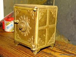 CAST IRON BANK IN THE SHAPE OF A SAFE. "IDEAL SECURITY". COMBINATION IS ON BACK. 4.25''X3.5''X5.5''