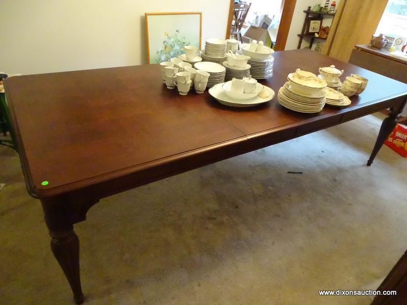 (DR) LIKE NEW HUGE FAMILY GATHERING DINING ROOM TABLE. HAS WALNUT WOOD TONE FINISH AND 2 BOARDS.