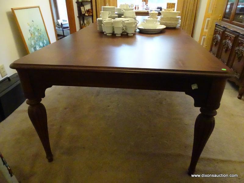 (DR) LIKE NEW HUGE FAMILY GATHERING DINING ROOM TABLE. HAS WALNUT WOOD TONE FINISH AND 2 BOARDS.