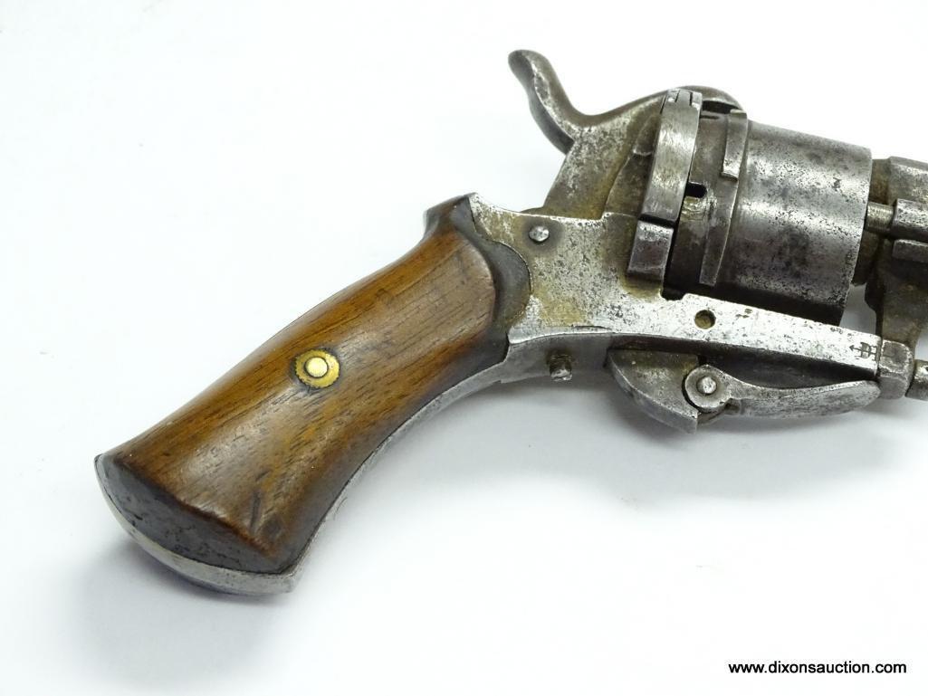 (SC) ANTIQUE 6 SHOT .25 CAL. REVOLVER. 7.5" LONG. OCTAGON BARREL. THE TRIGGER FOLDS FORWARD AND IS