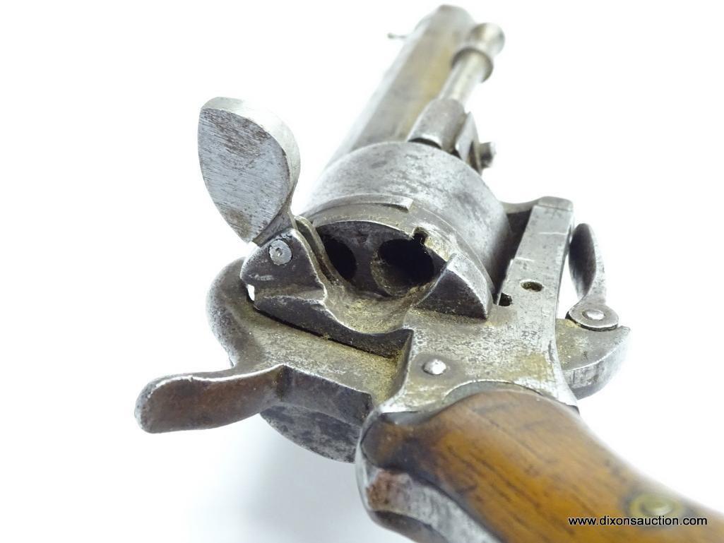 (SC) ANTIQUE 6 SHOT .25 CAL. REVOLVER. 7.5" LONG. OCTAGON BARREL. THE TRIGGER FOLDS FORWARD AND IS