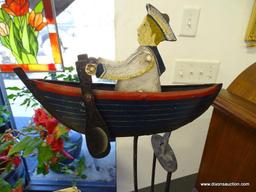(A1) VINTAGE NAUTICAL MOTION DRIVEN TOY OF A SAILOR ROWING HIS BOAT. 17" TALL. WOULD MAKE A VERY
