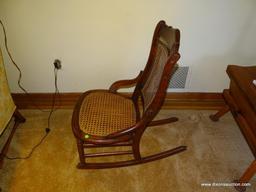 (LR) ANTIQUE VICTORIAN ROCKING CHAIR, HIP REST SIDES, CANE SEAT IN GOOD CONDITION, 19 1/2''L 32''W