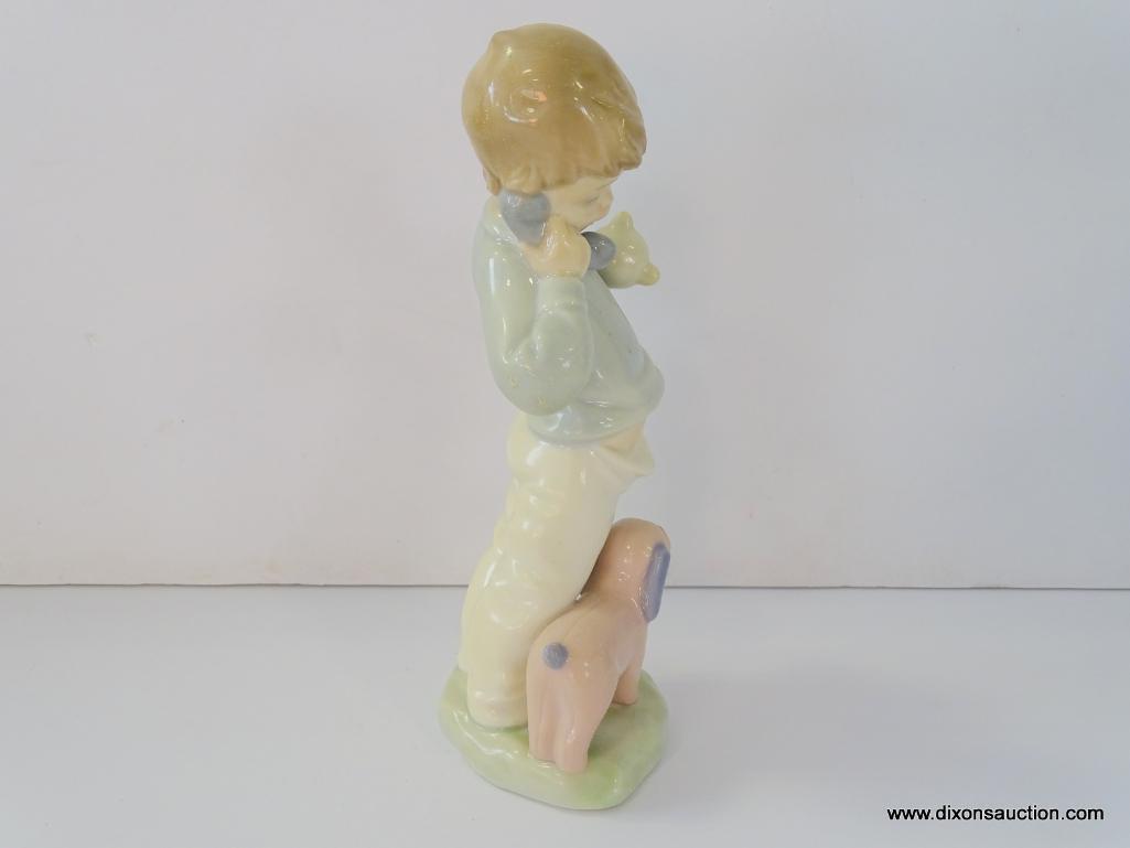 NAO BY LLADRO NINO AL TELEFONO CON MUNECOS. ITEM# 1044. 7" TALL. IN THE ORIGINAL BOX.