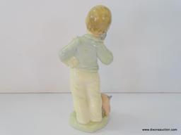 NAO BY LLADRO NINO AL TELEFONO CON MUNECOS. ITEM# 1044. 7" TALL. IN THE ORIGINAL BOX.