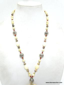 VINTAGE CARVED BONE TRIBAL FETISH NECKLACE WITH CARVED BONE. 26". THE PENDANT HAS A 6.5" DROP. IS