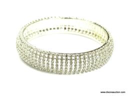 RHINESTONE SET 7 ROWS WIDE MEASURES 5/8" WIDE 2.5" ACROSS THE INSIDE AND IS IN EXCELLENT CONDITION.