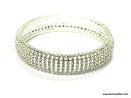 RHINESTONE SET 7 ROWS WIDE MEASURES 5/8" WIDE 2.5" ACROSS THE INSIDE AND IS IN EXCELLENT CONDITION.