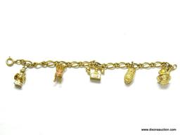 VINTAGE AVON CHARM BRACELET. GOLD TONE FINISH. CHARMS INCLUDE ANTIQUE PITCHER AND WASH BOWL, SOLID