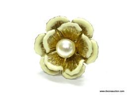 VINTAGE FLOWER SHAPED CONVERSATION RING SIZE 5.5. FLOWER 1.25" ACROSS. HAS A FAUX PEARL IN THE