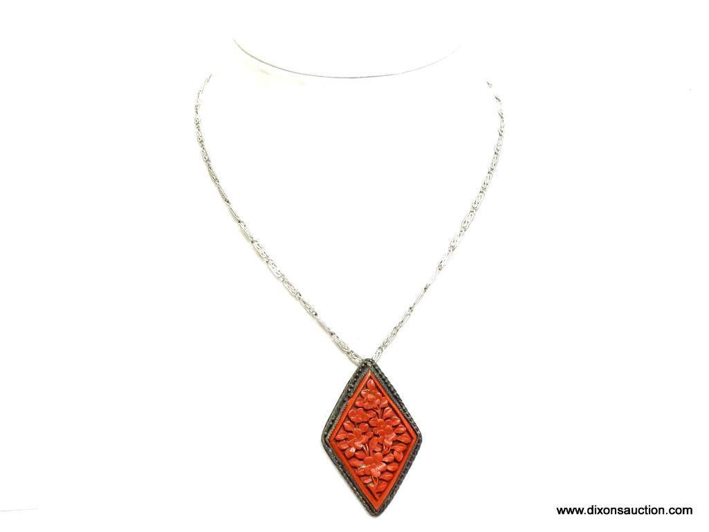 Vintage Carved Cinnobar Diamond Shaped Pendant Necklace. The pendant measures 2.25" long and comes
