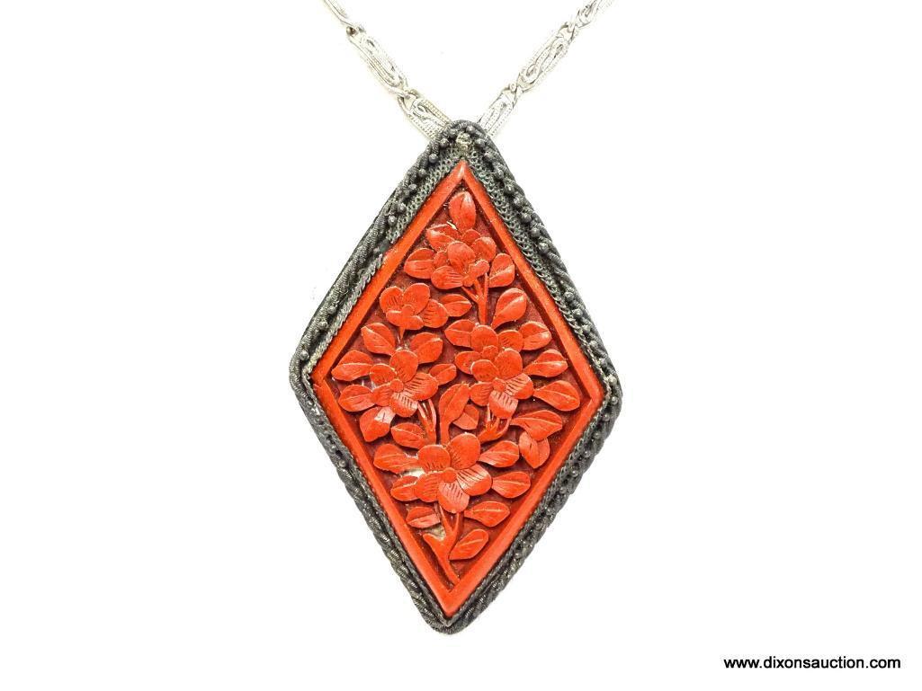 Vintage Carved Cinnobar Diamond Shaped Pendant Necklace. The pendant measures 2.25" long and comes