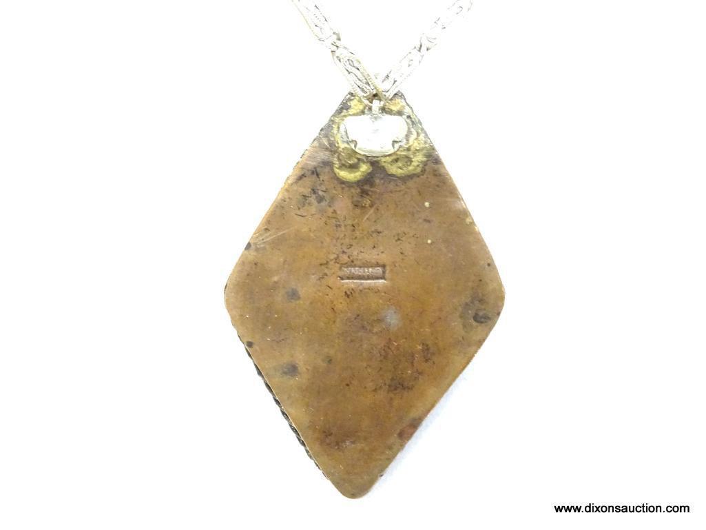 Vintage Carved Cinnobar Diamond Shaped Pendant Necklace. The pendant measures 2.25" long and comes