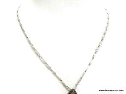 Vintage Carved Cinnobar Diamond Shaped Pendant Necklace. The pendant measures 2.25" long and comes