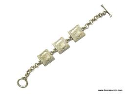 BEAUTIFUL ROLO LINK TOGGLE CLASP BRACELET WITH 3 HAMMERED SQUARE PANELS SET WITH LIGHT BLUE STONES.