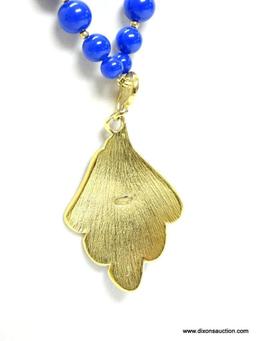 VINTAGE SIGNED TRIFARI BLUE AND GOLD TONE DROP PENDANT BEAD NECKLACE. 27" LONG. DROP PENDANT 3.25"