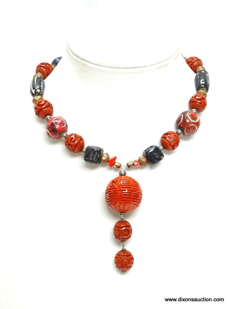 VINTAGE CARVED CINNABAR ROUND BALL OF LIFE DROP PENDANT NECKLACE. 17" LONG. PENDANT HAS 3" DROP.