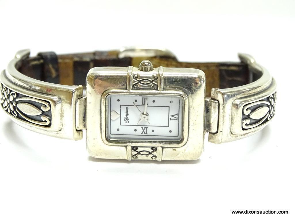 BRIGHTON MADRID LADIES WATCH. HAS A GOLD TONE HEART AT THE 12 O'CLOCK MARKER, WITH ROMAN NUMERALS AT