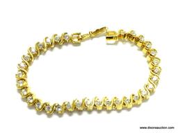 GOLD VERMEIL TENNIS BRACELET. 7" LONG. LOOKS LIKE A DIAMOND TENNIS BRACELET. IN GOOD CONDITION.