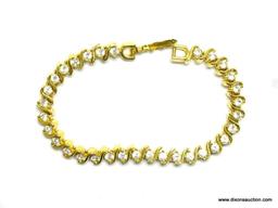 GOLD VERMEIL TENNIS BRACELET. 7" LONG. LOOKS LIKE A DIAMOND TENNIS BRACELET. IN GOOD CONDITION.