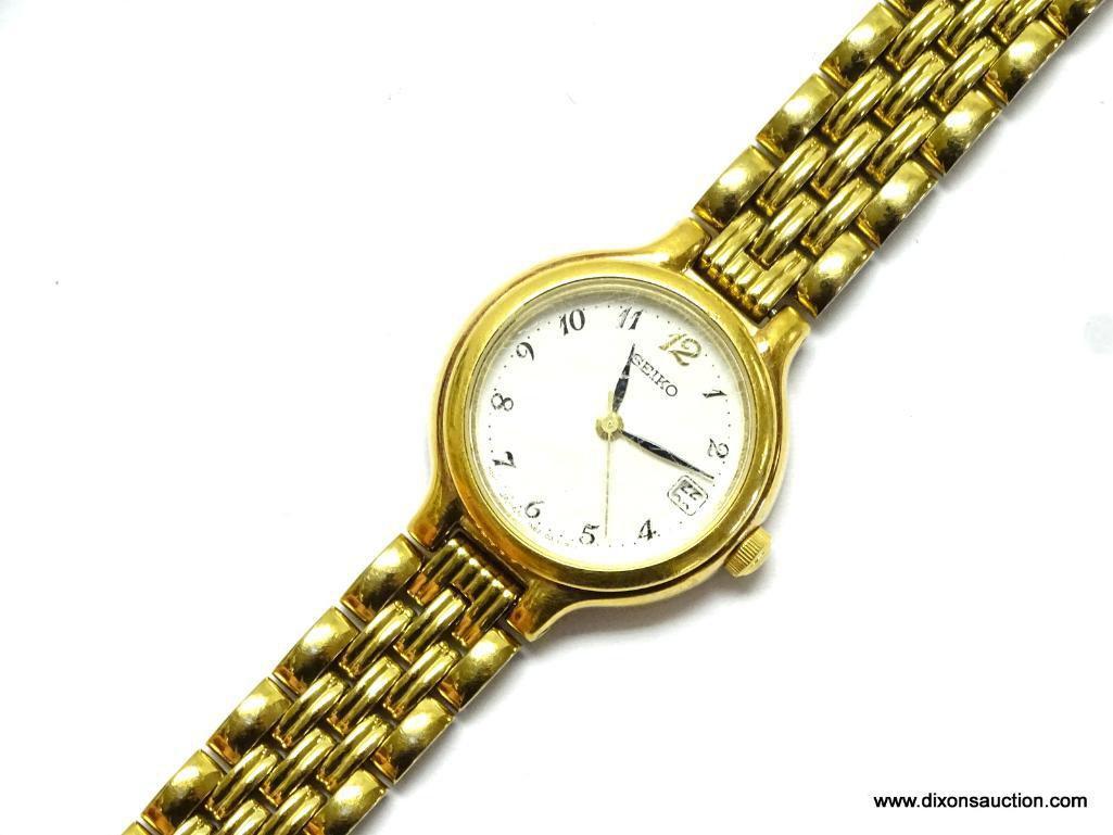 SEIKO LADIES WATCH. GOLD TONE BRACELET AND CASE. MODEL# 7N82-0228. THIS WATCH HAS A DATE WINDOW. IS
