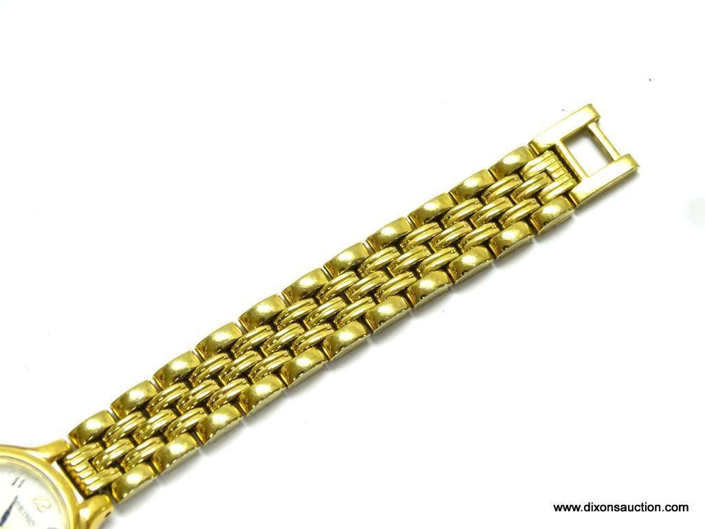 SEIKO LADIES WATCH. GOLD TONE BRACELET AND CASE. MODEL# 7N82-0228. THIS WATCH HAS A DATE WINDOW. IS