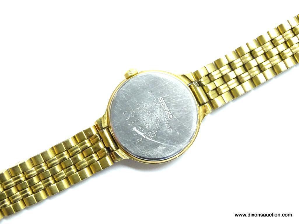 SEIKO LADIES WATCH. GOLD TONE BRACELET AND CASE. MODEL# 7N82-0228. THIS WATCH HAS A DATE WINDOW. IS