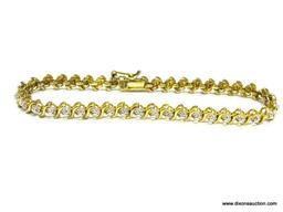 STERLING SILVER WITH GOLD VERMEIL TENNIS BRACELET. 7.5" LONG.