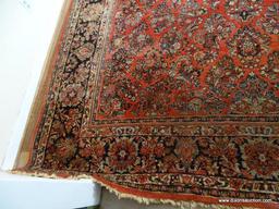 (LR) LARGE ROOM SIZE ORIENTAL RUG. HANDMADE. APPROX. 10FT 10 IN BY 13FT 4IN. GOOD USED CONDITION.