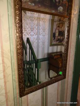 (F) VINTAGE BEVELED GLASS MIRROR WITH FLORAL PRINT AT THE TOP. 13.75"X28".