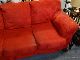 (ROW 1) RED SUEDE 3 CUSHION SOFA. IS IN VERY GOOD USED CONDITION: 89"x37"x36". DELIVERY IS AVAILABLE