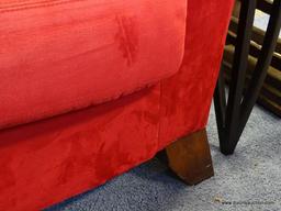 (ROW 1) RED SUEDE 3 CUSHION SOFA. IS IN VERY GOOD USED CONDITION: 89"x37"x36". DELIVERY IS AVAILABLE