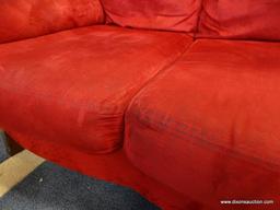 (ROW 1) RED SUEDE 3 CUSHION SOFA. IS IN VERY GOOD USED CONDITION: 89"x37"x36". DELIVERY IS AVAILABLE