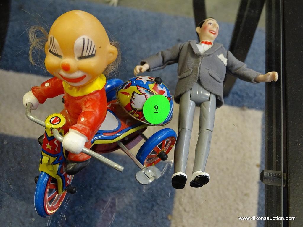 (ROW 1) VINTAGE WINDUP CLOWN ON TRICYCLE TOY AND PEE WEE HERMAN 6" TALL TOY WITH MOVEABLE ARMS,