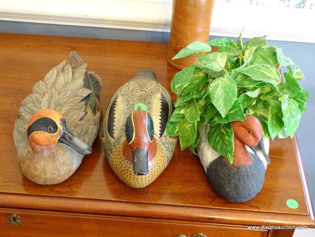 (DR) LOT OF 3 DUCK RELATED ITEMS: 2 ARE CARVED WOODEN DUCKS AND 1 IS A DUCK SHAPED PLANTER.