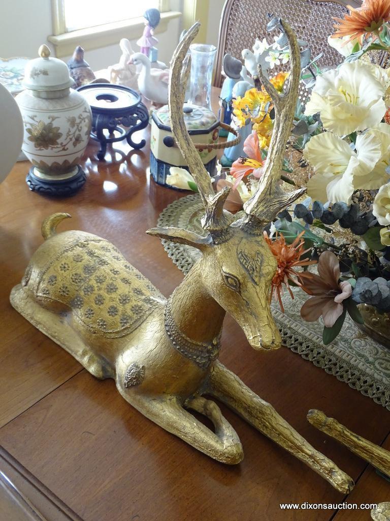 (DR) MISC. LOT: 2 GOLD PAINTED DEER. DINING TABLE COVERLET. FLORAL ARRANGEMENT IN BRASS PLANTER.