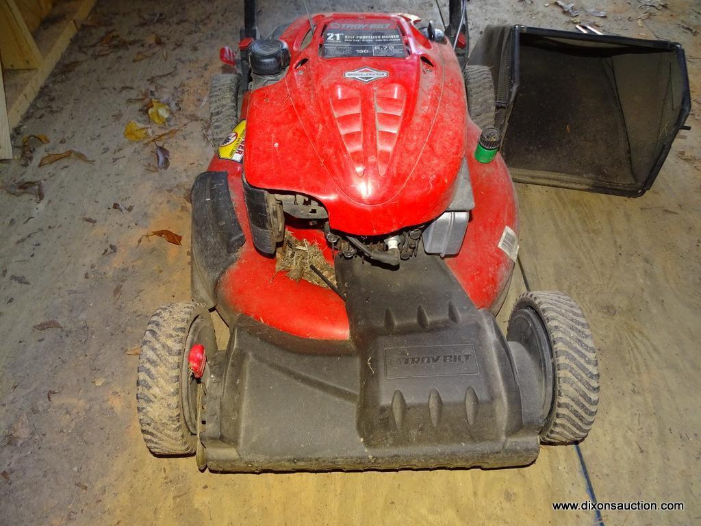 (SHED) TROY BILT PUSH MOWER WITH BAGGER ATTACHMENT. HAS A BRIGGS AND STRATTON ENGINE: 22"x58"x41"