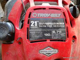 (SHED) TROY BILT PUSH MOWER WITH BAGGER ATTACHMENT. HAS A BRIGGS AND STRATTON ENGINE: 22"x58"x41"