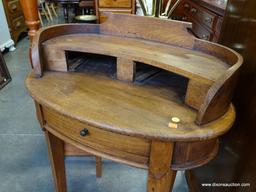 (A1) OVAL WALNUT 1 DRAWER TABLE WITH ELEVATED GALLERY. 28X19X34.5