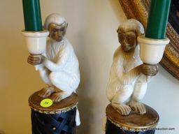 (DR) PAIR OF WHITE AND BROWN MONKEYS ON PILLARS STYLE CANDLESTICK HOLDERS: 1' TALL
